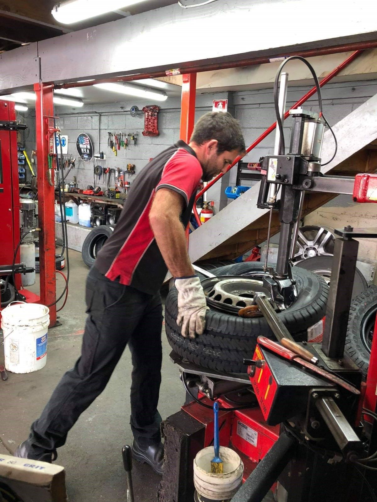 A Haslips technician on the tyre machine in the Panmure workshop